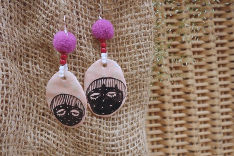 Ceramic earring inspired by woman face in pink :)