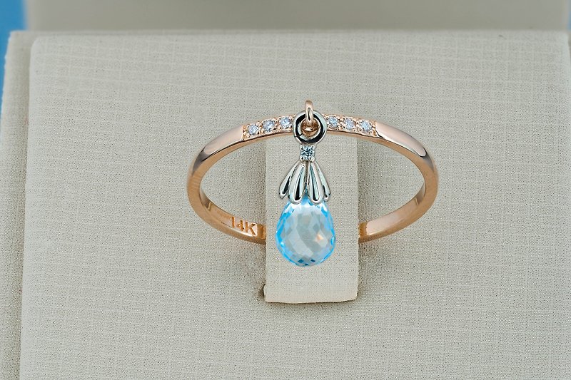 14k gold ring with topaz  briolettes and diamonds.